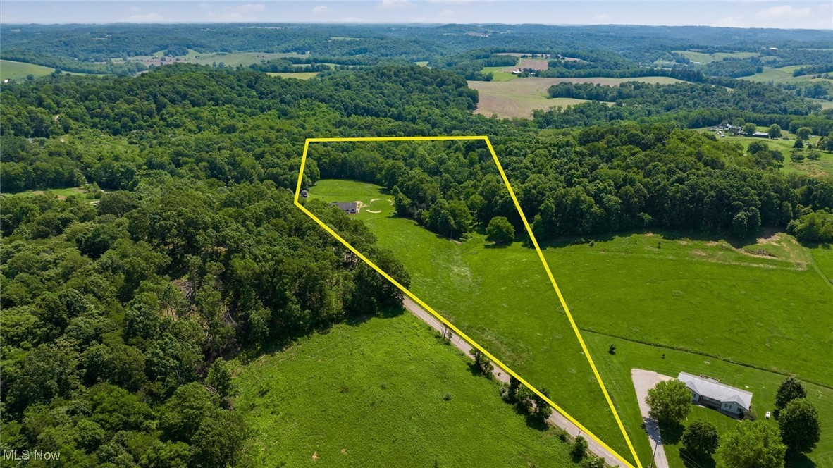 9910 Matchett Road Norwich, OH 43767 - Photo 39 of 48 Aerial view of sparsely populated area featuring property parcel outlined and a forest