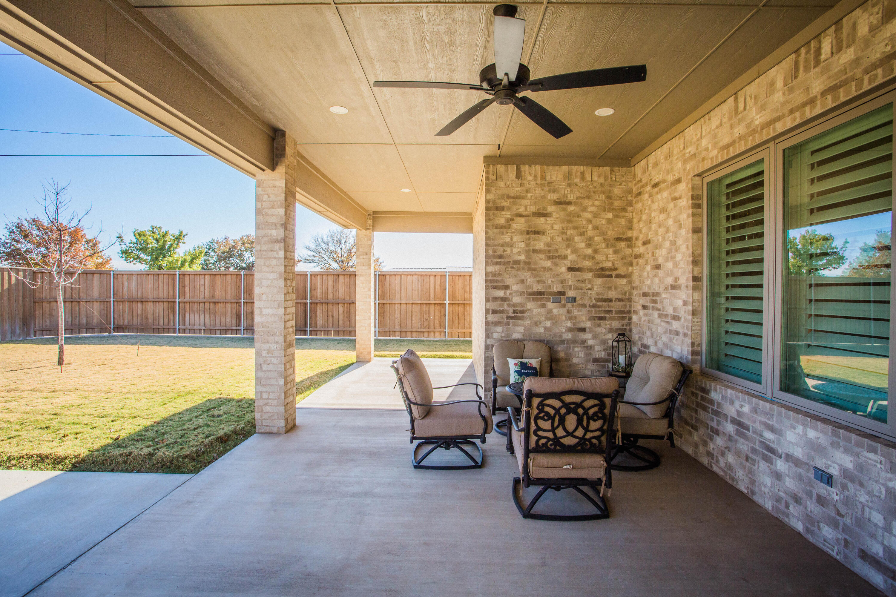 209 South Holliday Plainview, TX 79072 - Photo 23 of 29 a building outdoor space with patio furniture and potted plants