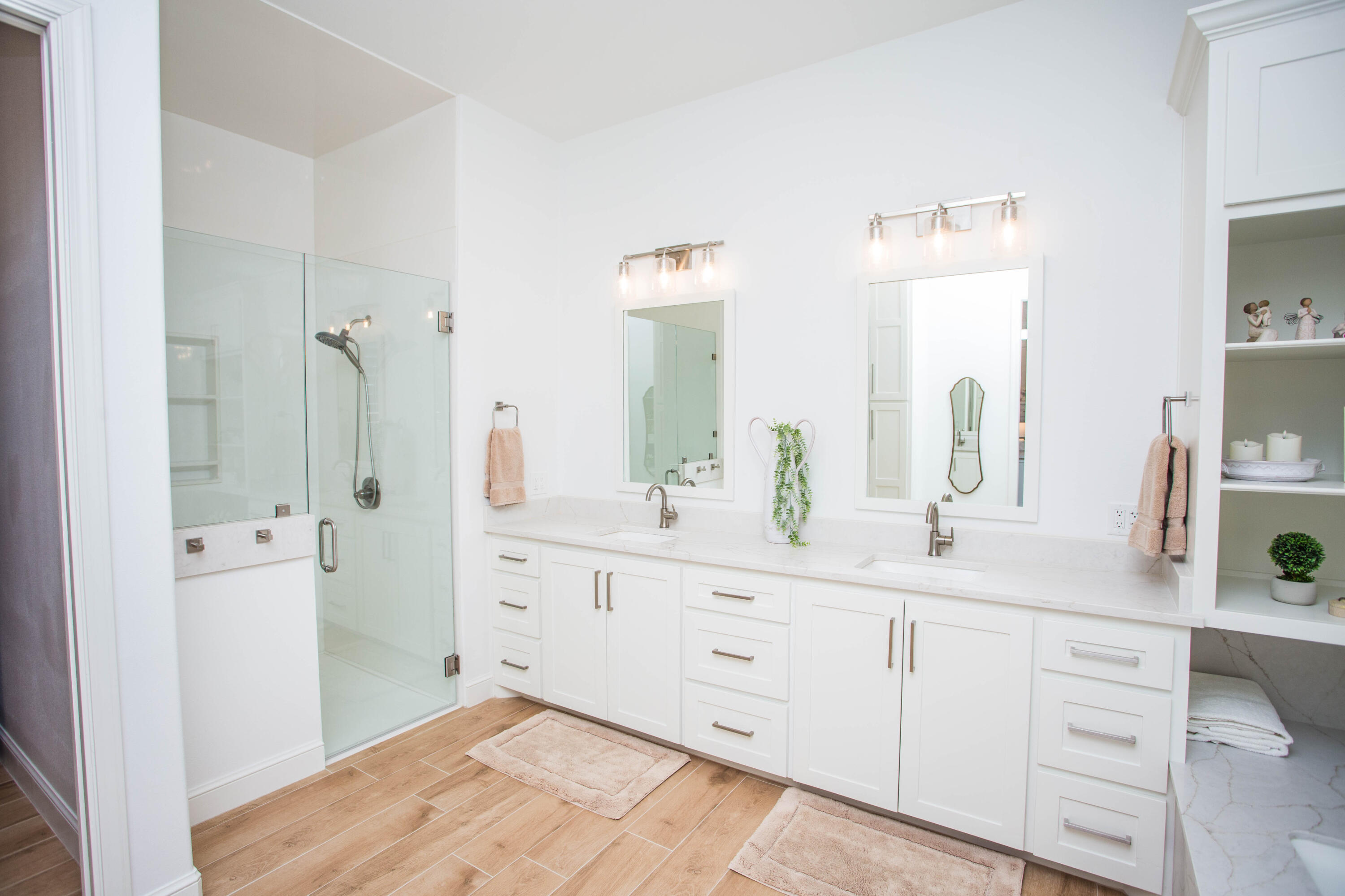 209 South Holliday Plainview, TX 79072 - Photo 5 of 29 a spacious bathroom with double vanity a mirror and a shower