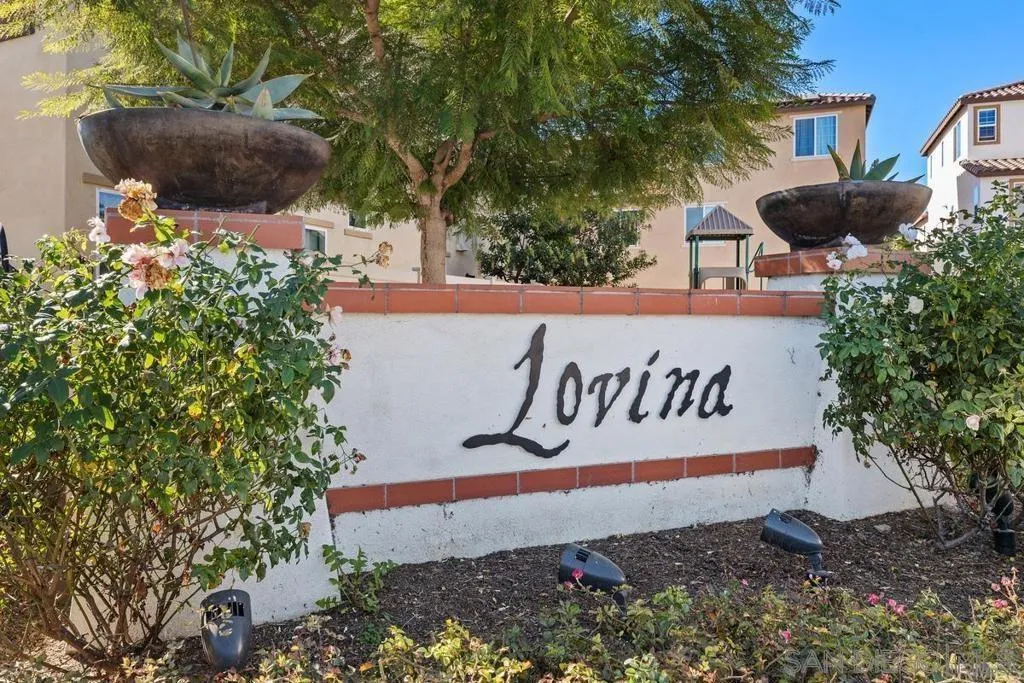 1319 Keck Road Chula Vista, CA 91913 - Photo 29 of 49 a sign that is sitting in front of flowers