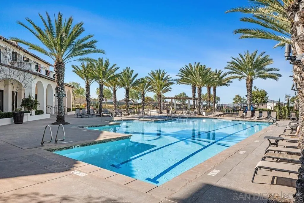 1319 Keck Road Chula Vista, CA 91913 - Photo 42 of 49 a row of palm trees and swimming pool in the backyard of a house
