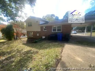 a view of a house with a back yard