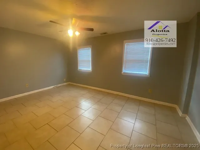 a view of an empty room and a window