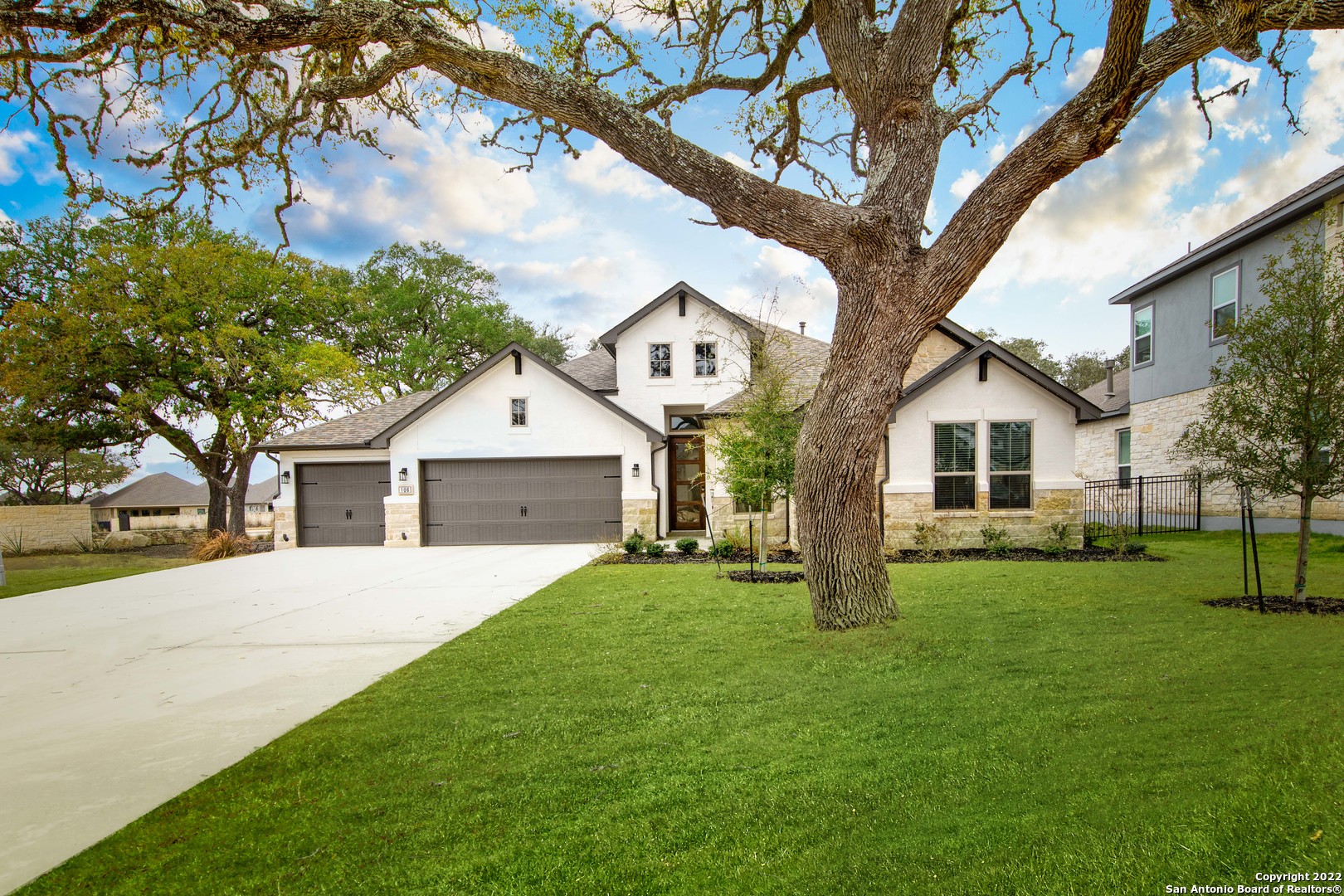 106 Milagro Boerne, TX 78006 - Photo 1 of 29 a front view of house with yard and green space