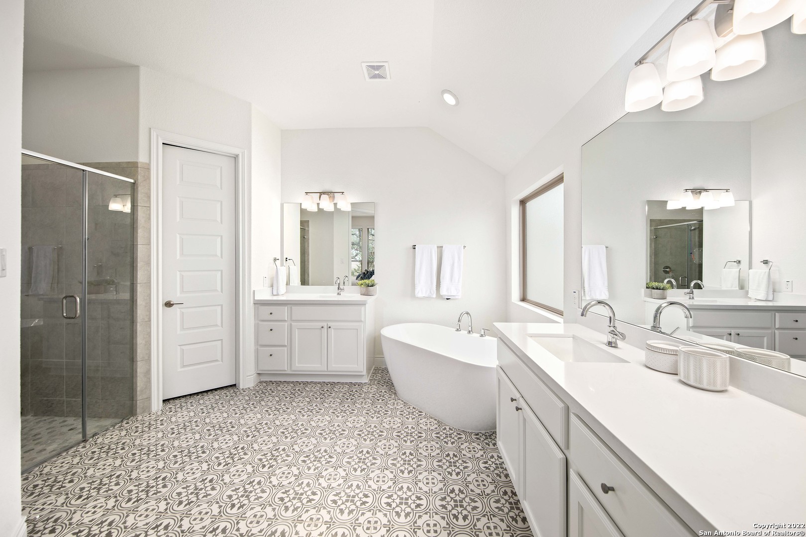 106 Milagro Boerne, TX 78006 - Photo 18 of 29 a large bathroom with a double vanity sink a mirror and a bathtub