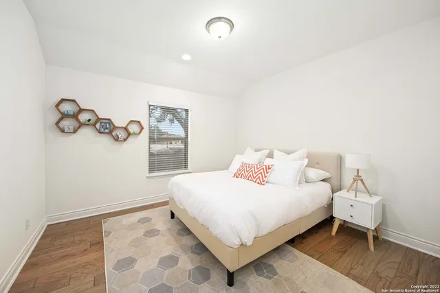 a bedroom with a bed and a table