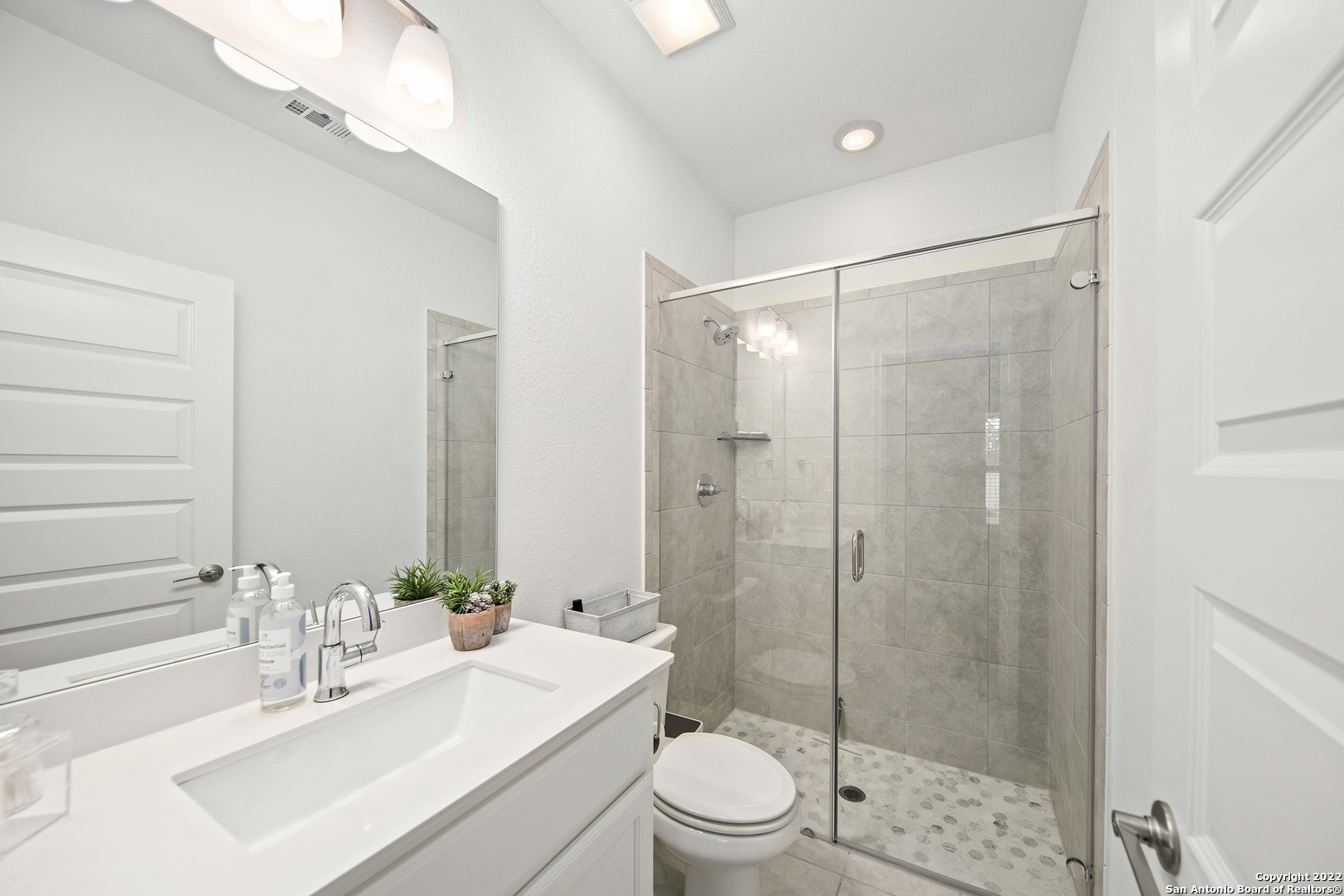 106 Milagro Boerne, TX 78006 - Photo 23 of 29 a bathroom with a sink mirror shower and toilet
