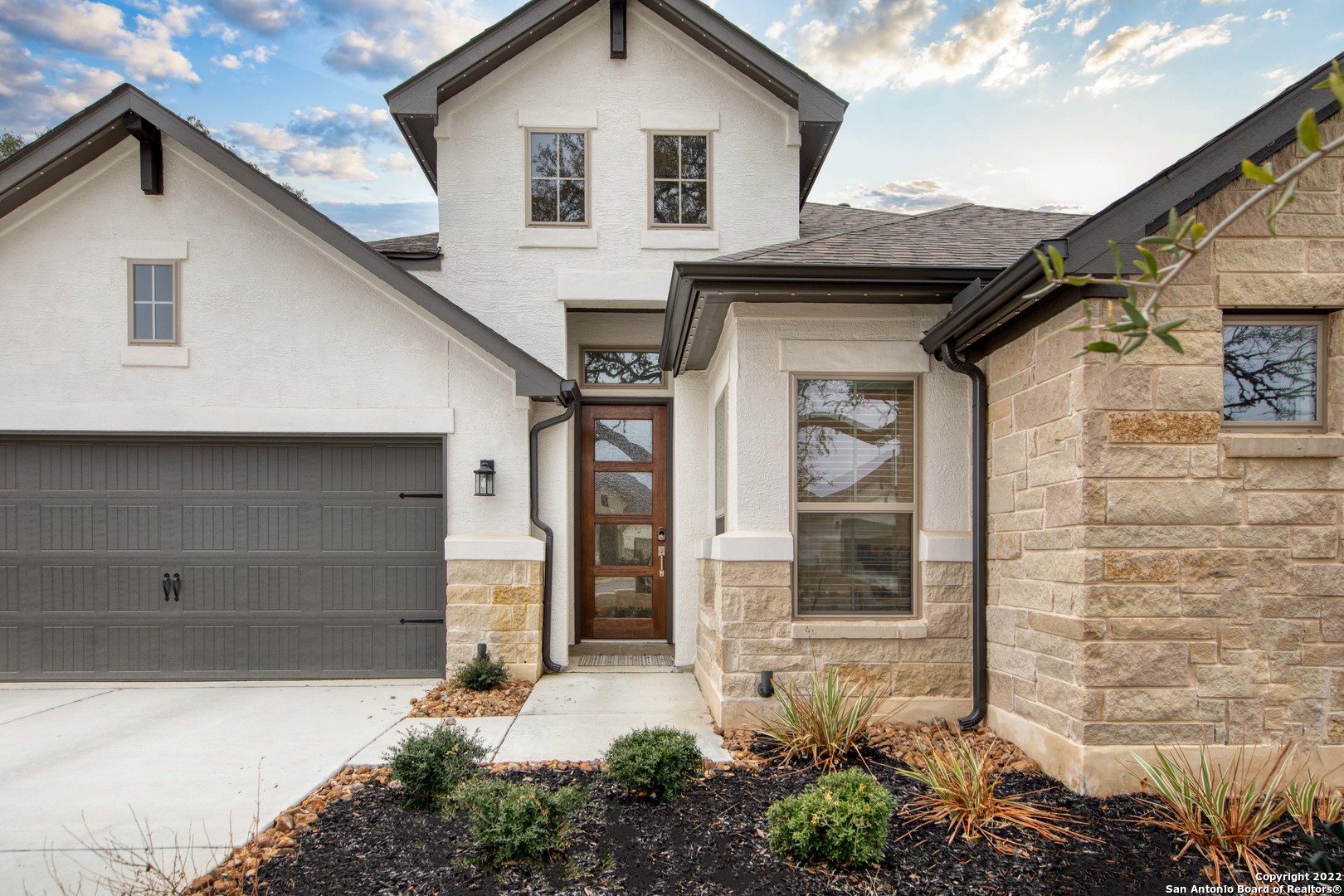 106 Milagro Boerne, TX 78006 - Photo 27 of 29 a front view of a house with a yard