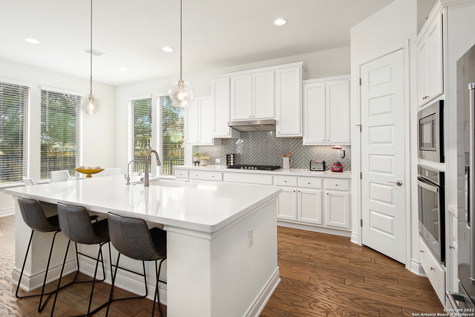 106 Milagro Boerne, TX 78006 - Photo 8 of 29 a kitchen with appliances cabinets and a sink