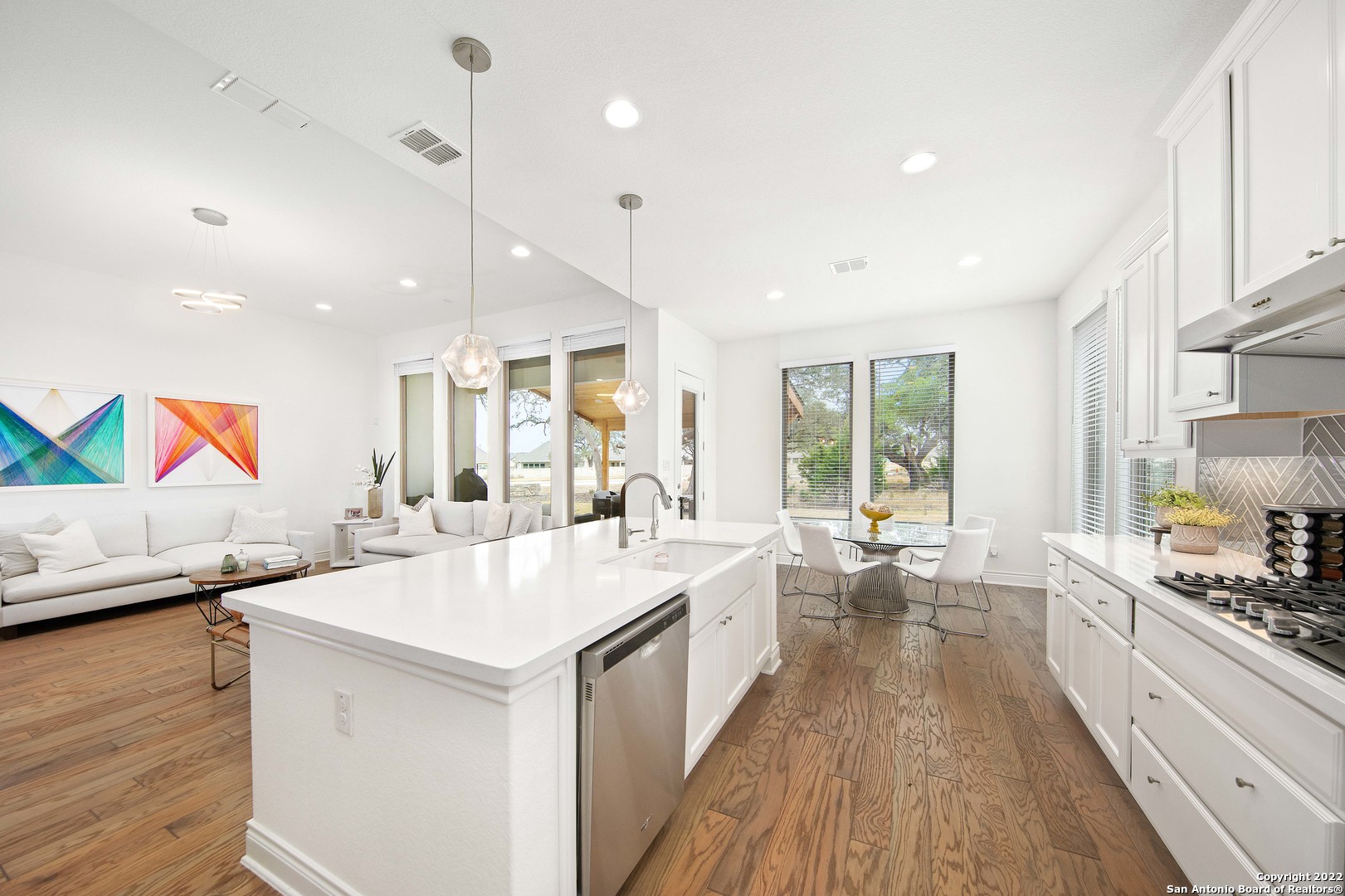 106 Milagro Boerne, TX 78006 - Photo 10 of 29 a large white kitchen with a large window a sink and appliances