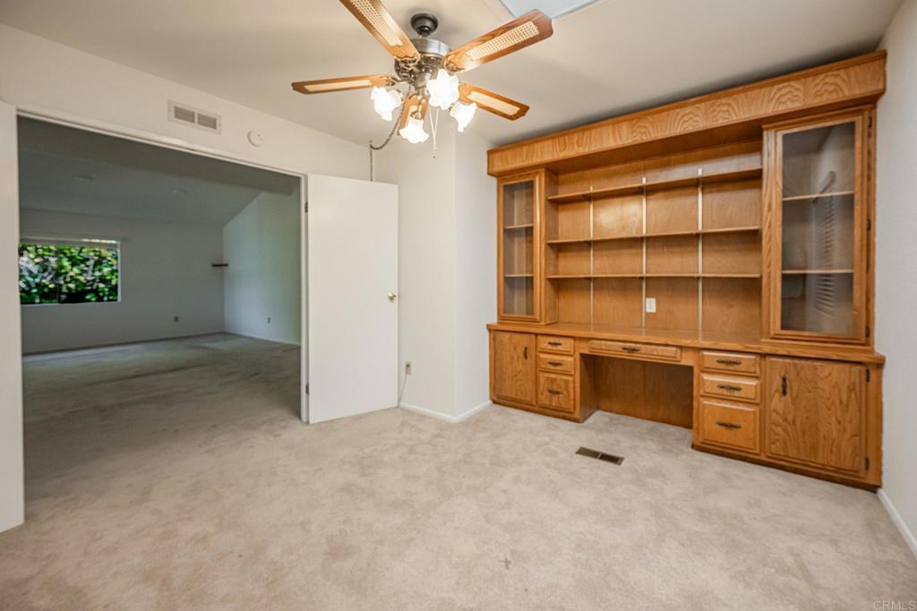 4650 Dulin Road, Unit 178 Fallbrook, CA 92003 - Photo 18 of 53 a view of an empty room with a cabinet and a window