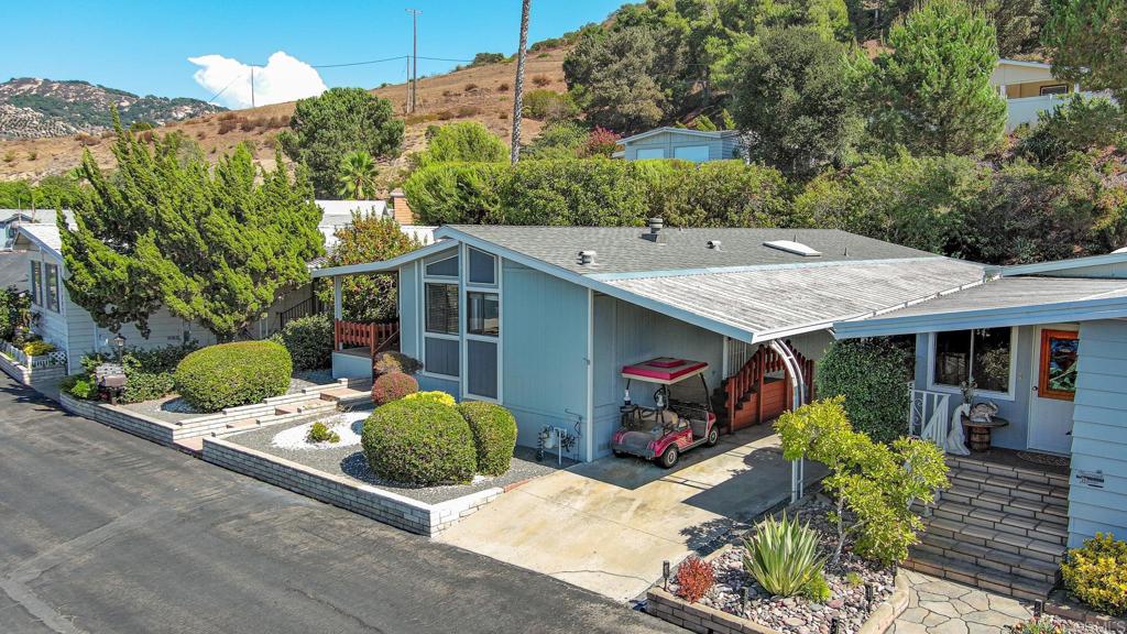 4650 Dulin Road, Unit 178 Fallbrook, CA 92003 - Photo 44 of 53 a view of a patio with table and chairs potted plants