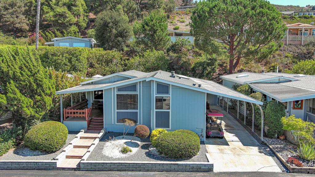 4650 Dulin Road, Unit 178 Fallbrook, CA 92003 - Photo 45 of 53 a view of a house with more windows and plants