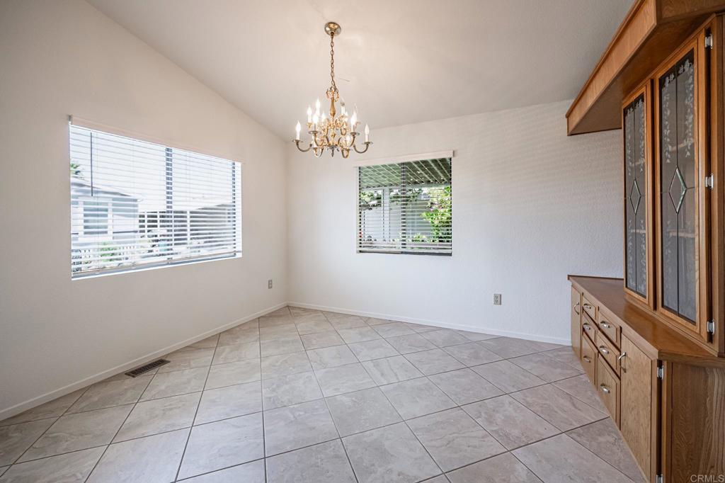 4650 Dulin Road, Unit 178 Fallbrook, CA 92003 - Photo 10 of 53 a view of livingroom with chandelier