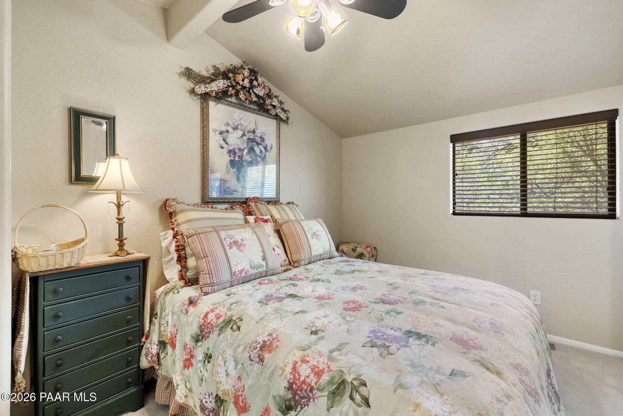 535 Copper Basin Road Prescott, AZ 86303 - Photo 26 of 41 a bedroom with a bed and a chandelier