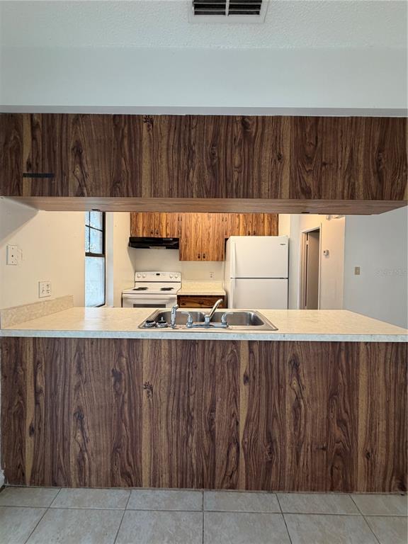 6820 Northeast 7th Street, Unit B Ocala, FL 34470 - Photo 6 of 11 a view of kitchen with cabinets