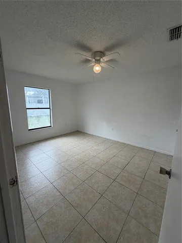a kitchen with white cabinets and a sink