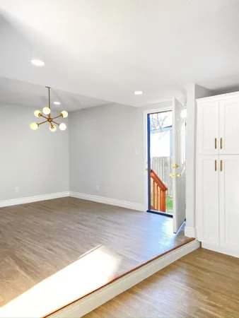 a view of a patio with chairs and plants