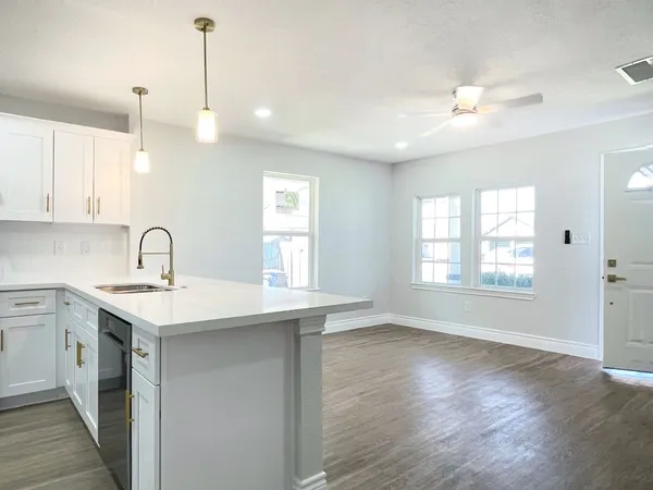 a bathroom with a sink and a window