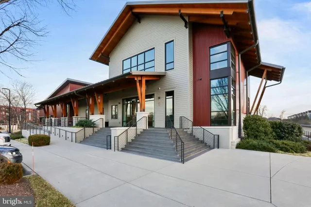 a view of a house with floor to ceiling windows