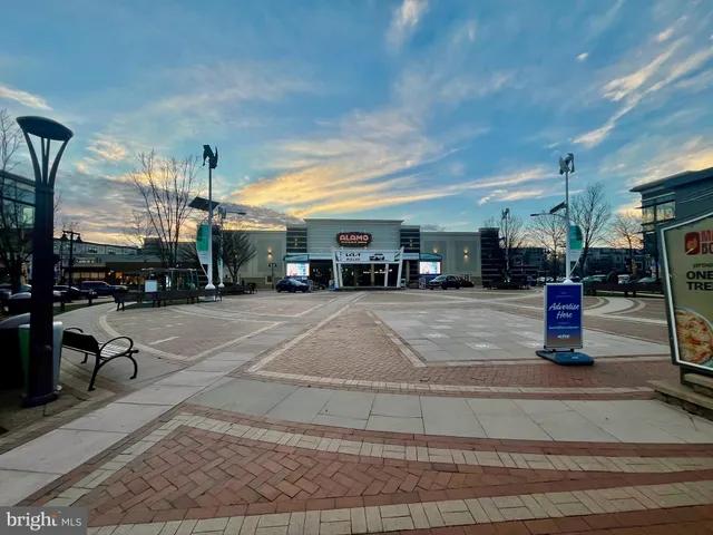 a swimming pool with outdoor seating and yard