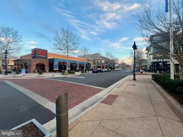 a view of swimming pool with a yard and a fountain
