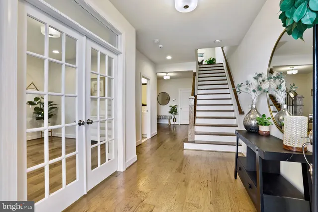 a view of entryway with wooden floor and stairs