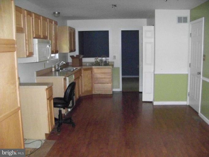 75 Cambridge Road Elkton, MD 21921 - Photo 3 of 7 a view of a kitchen with workspace and a window