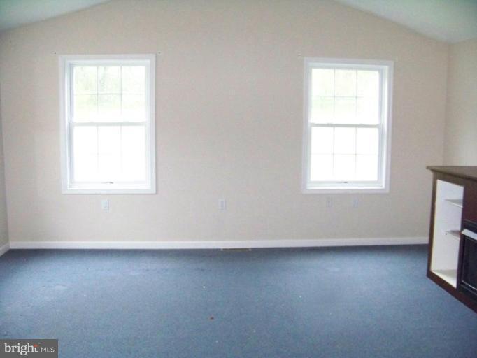75 Cambridge Road Elkton, MD 21921 - Photo 6 of 7 an empty room with wooden floor and windows