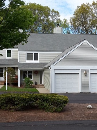 161 Stone Ridge Road, Unit 161 Franklin, MA 02038 - Photo 1 of 23 a front view of a house with a yard