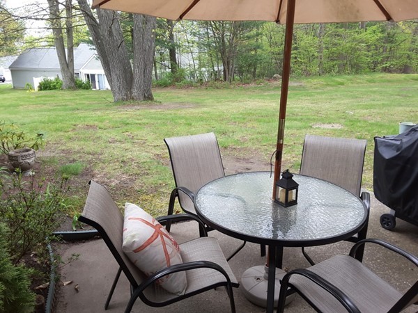 161 Stone Ridge Road, Unit 161 Franklin, MA 02038 - Photo 13 of 23 a outdoor view from a dining room with garden
