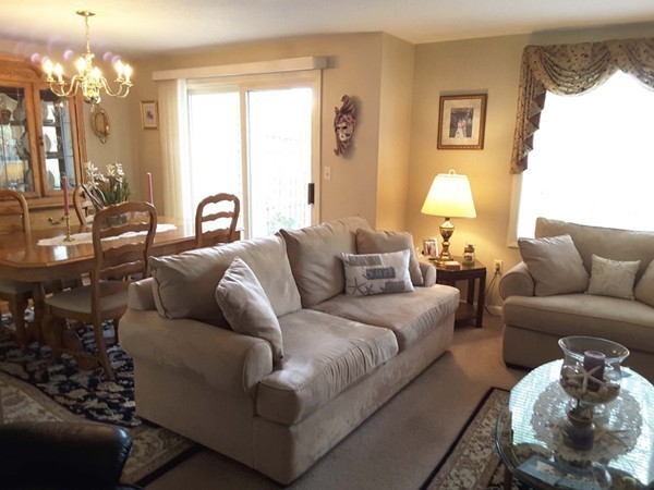 161 Stone Ridge Road, Unit 161 Franklin, MA 02038 - Photo 15 of 23 a living room with furniture and a large window