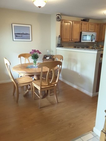 161 Stone Ridge Road, Unit 161 Franklin, MA 02038 - Photo 5 of 23 a dining room with furniture and a window