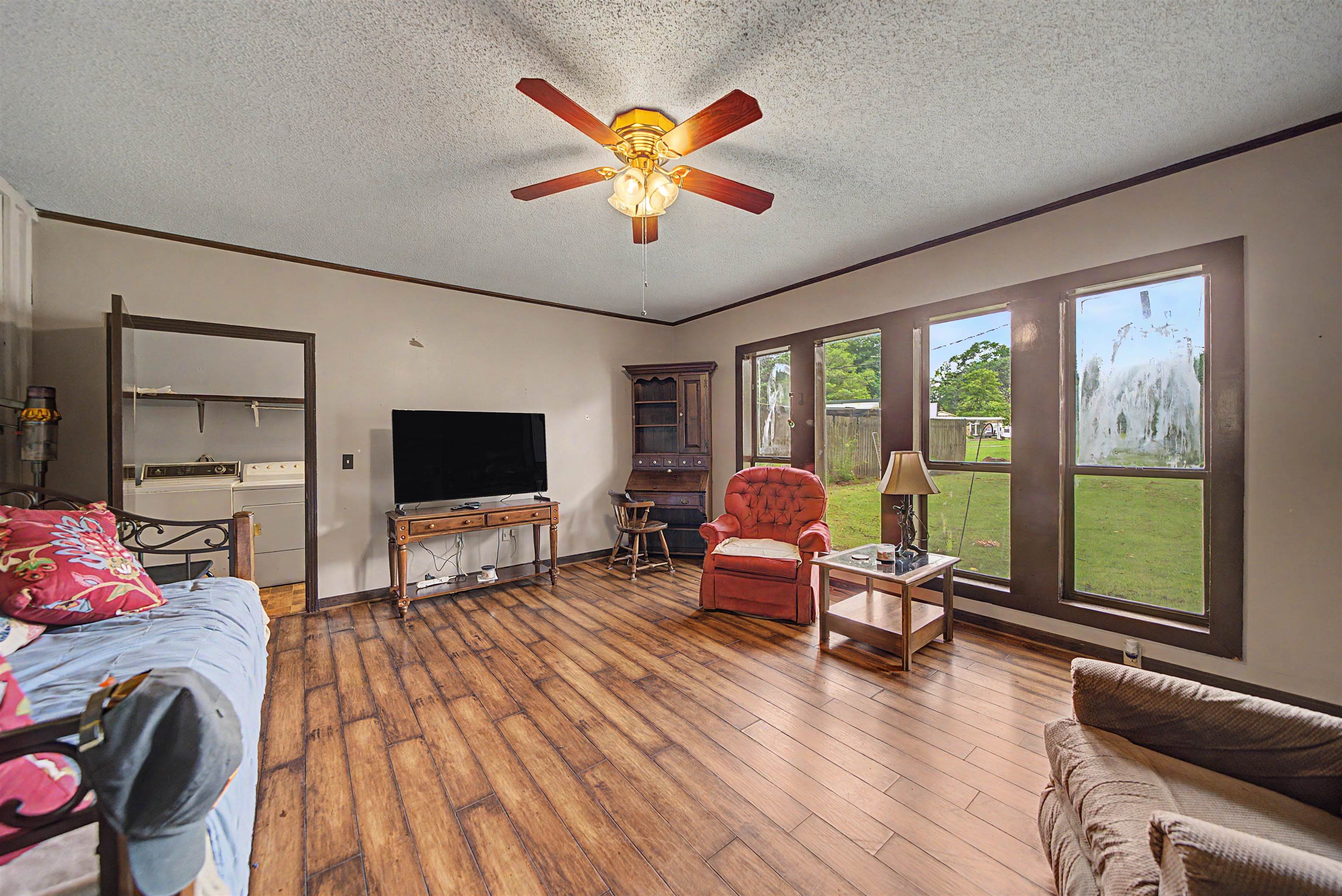 12 Baker Road Selmer, TN 38375 - Photo 18 of 28 a living room with furniture flat screen tv and a large window