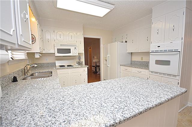 4019 Arno Road Franklin, TN 37064 - Photo 2 of 12 a kitchen with granite countertop a sink stove and refrigerator