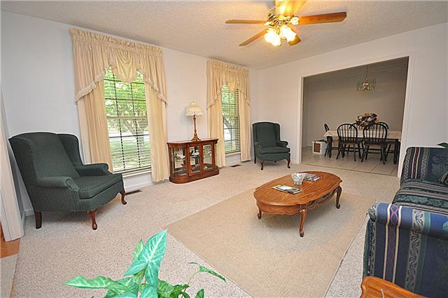 4019 Arno Road Franklin, TN 37064 - Photo 6 of 12 a living room with furniture a window and a chandelier