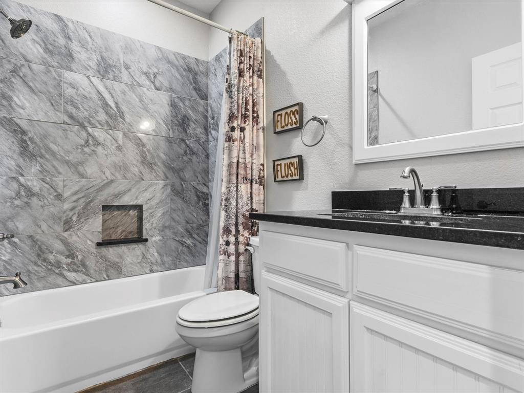 123 Kriston Lane Springtown, TX 76082 - Photo 17 of 39 a bathroom with a sink a toilet and a bathtub