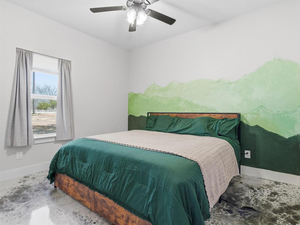 123 Kriston Lane Springtown, TX 76082 - Photo 18 of 39 a bedroom with a bed and window