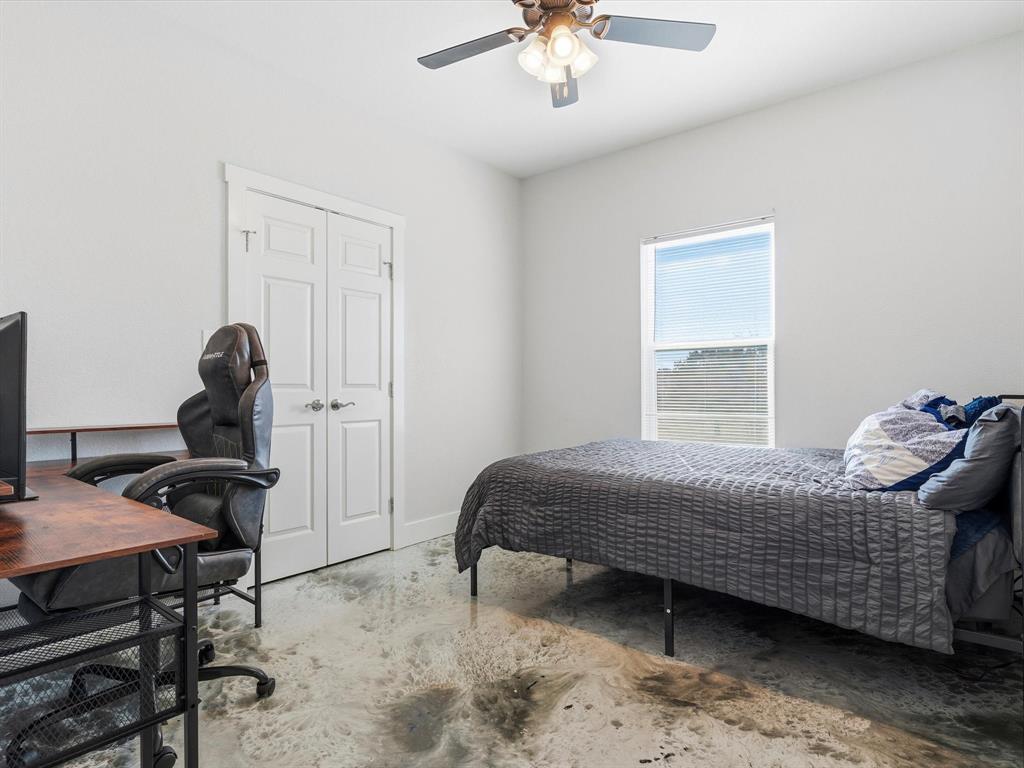 123 Kriston Lane Springtown, TX 76082 - Photo 20 of 39 a bedroom with a bed and a window