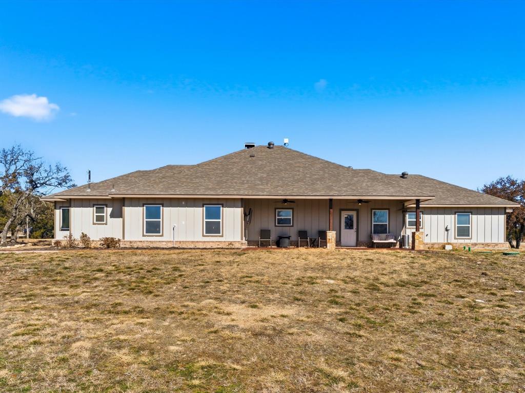 123 Kriston Lane Springtown, TX 76082 - Photo 30 of 39 a house with trees in the background