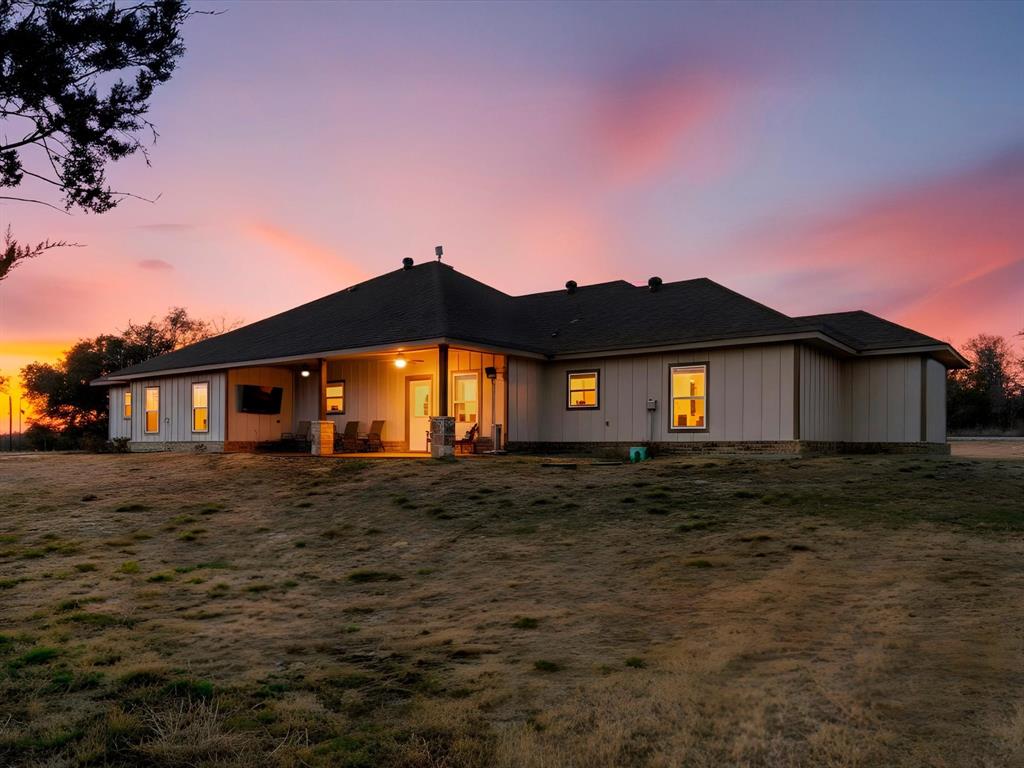 123 Kriston Lane Springtown, TX 76082 - Photo 4 of 39 a view of a house with a yard