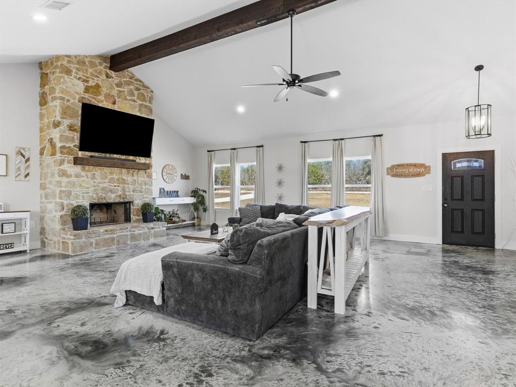 123 Kriston Lane Springtown, TX 76082 - Photo 7 of 39 a living room with fireplace furniture and a flat screen tv
