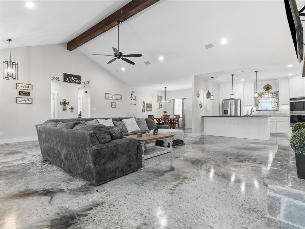 123 Kriston Lane Springtown, TX 76082 - Photo 8 of 39 a living room with furniture and a ceiling fan