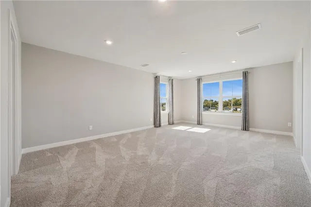 a view of a livingroom with a kitchen and a sink
