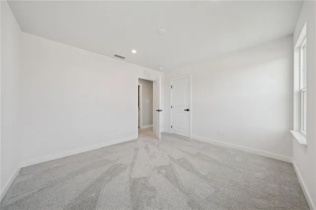 a bathroom with a double vanity sink toilet mirror and shower