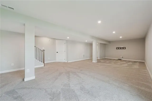 a bathroom with a toilet a sink and a mirror