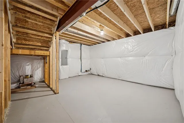 a front view of a house with a yard table and chairs