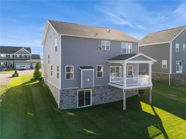 a view of a balcony with wooden floor