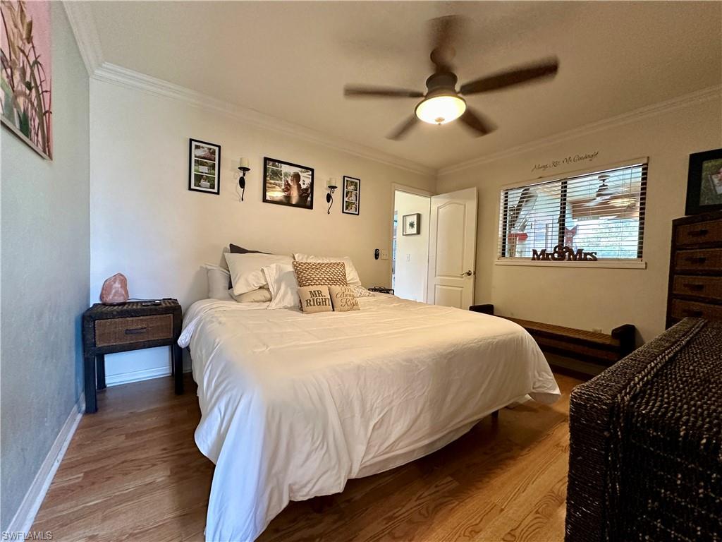 17444 Ingram Road Fort Myers, FL 33967 - Photo 18 of 27 Main Bedroom featuring ornamental molding, ceiling fan, and hardwood / wood-style floors