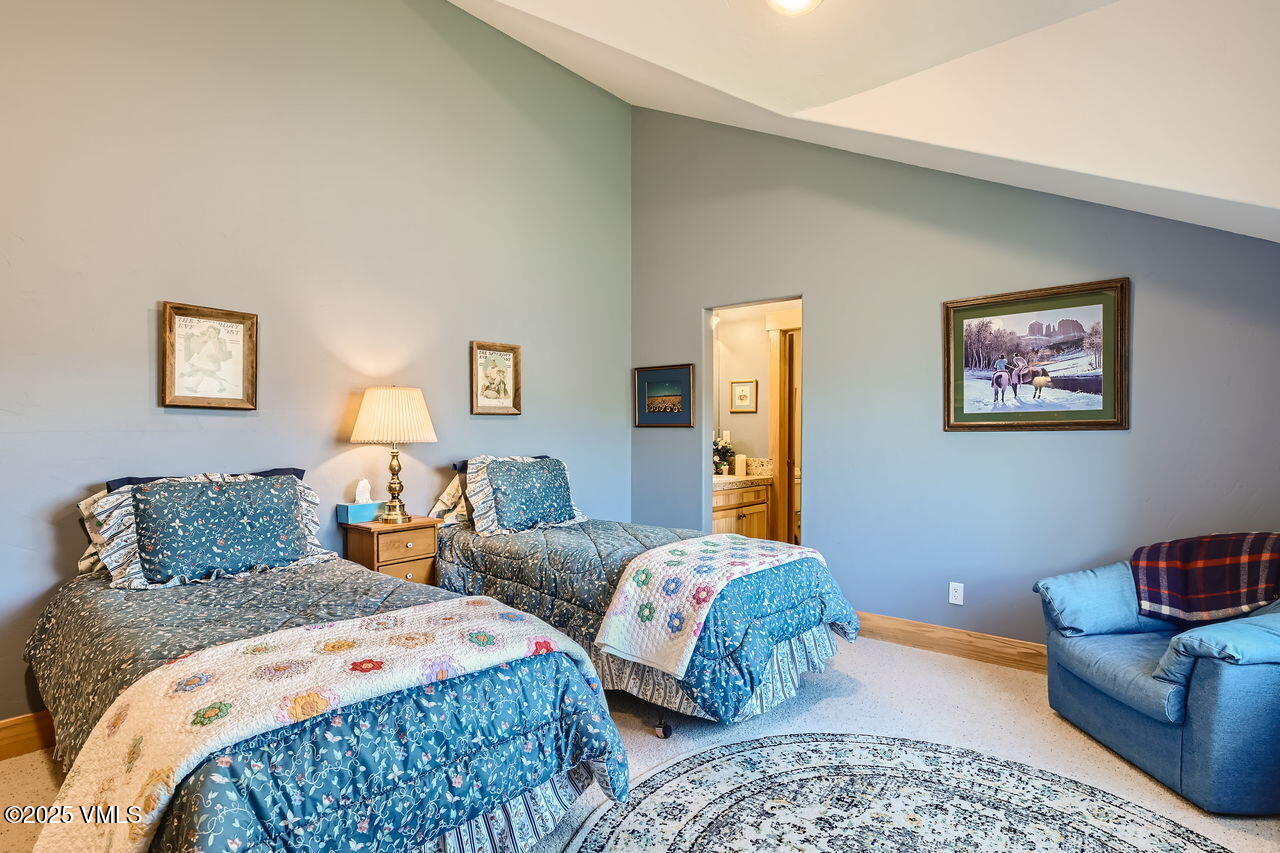 1987 Eagle Ranch Road Eagle, CO 81631 - Photo 26 of 37 a bedroom with two beds and painting on the wall